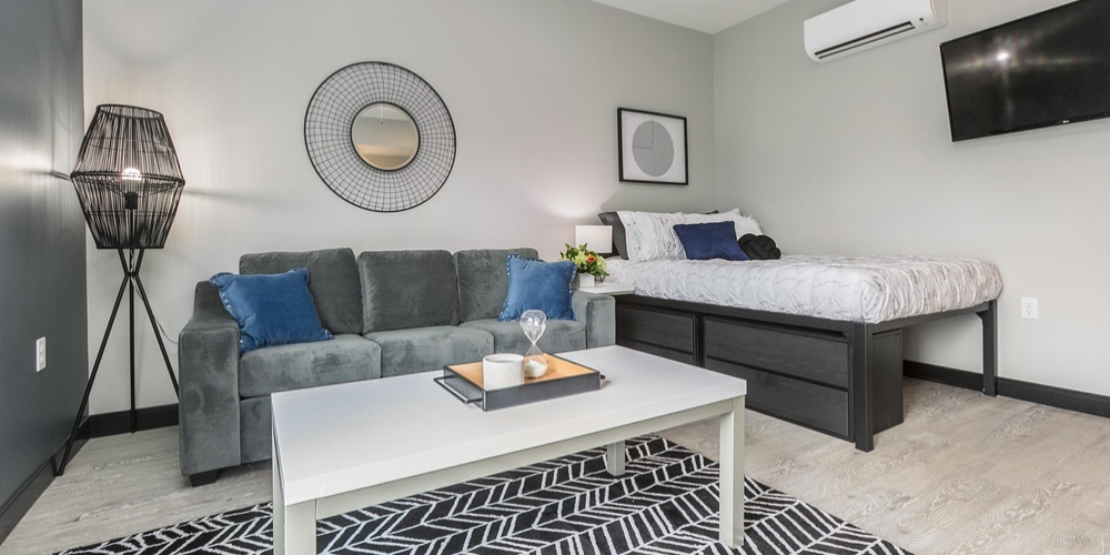 Each micro-effiiency studio apartment at Boomer Town Luxury Studios comes fully furnished with the modern, inviting furniture shown here.